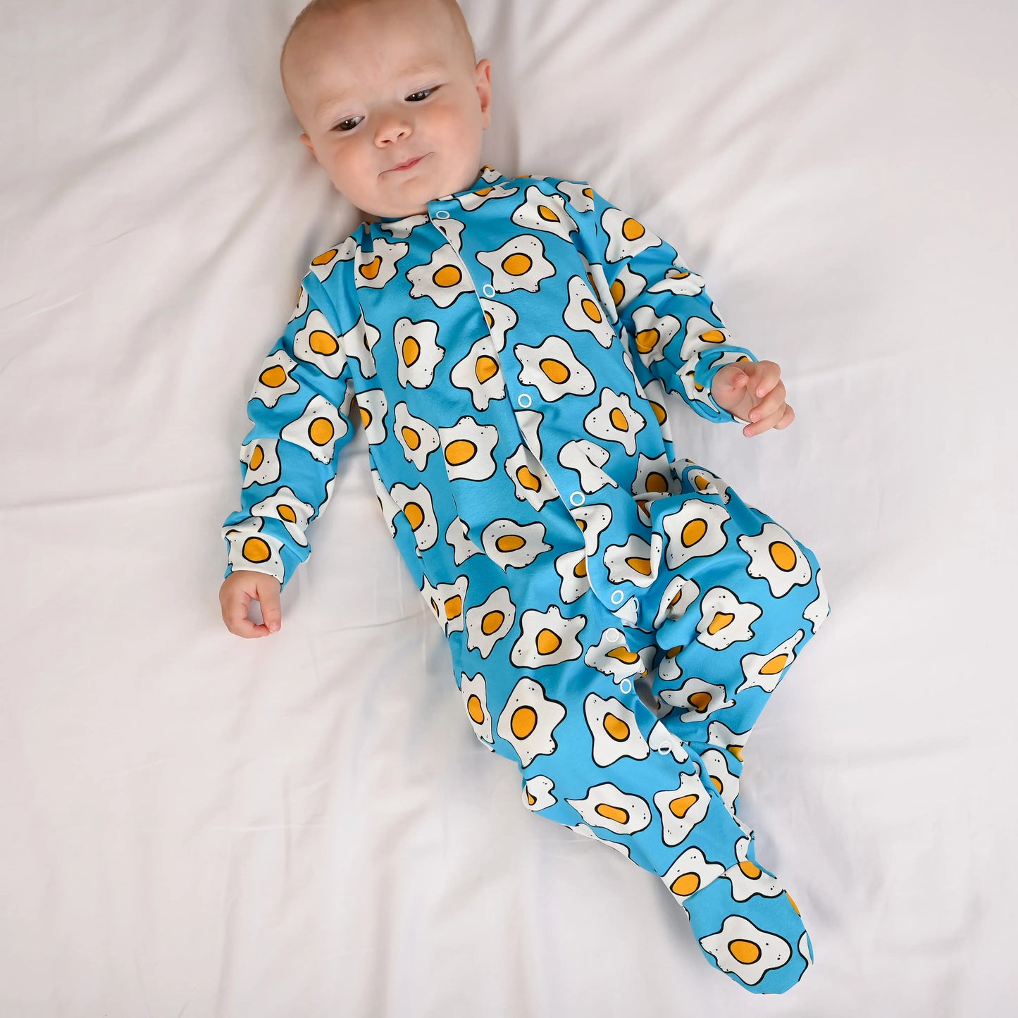 fred and noah eggies print cotton baby sleepsuit with eggy print at whippersnappers online