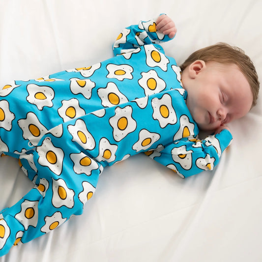 fred and noah eggies print cotton baby sleepsuit with eggy print at whippersnappers online