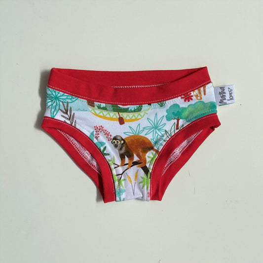martha loves pants with jungle print and red trim