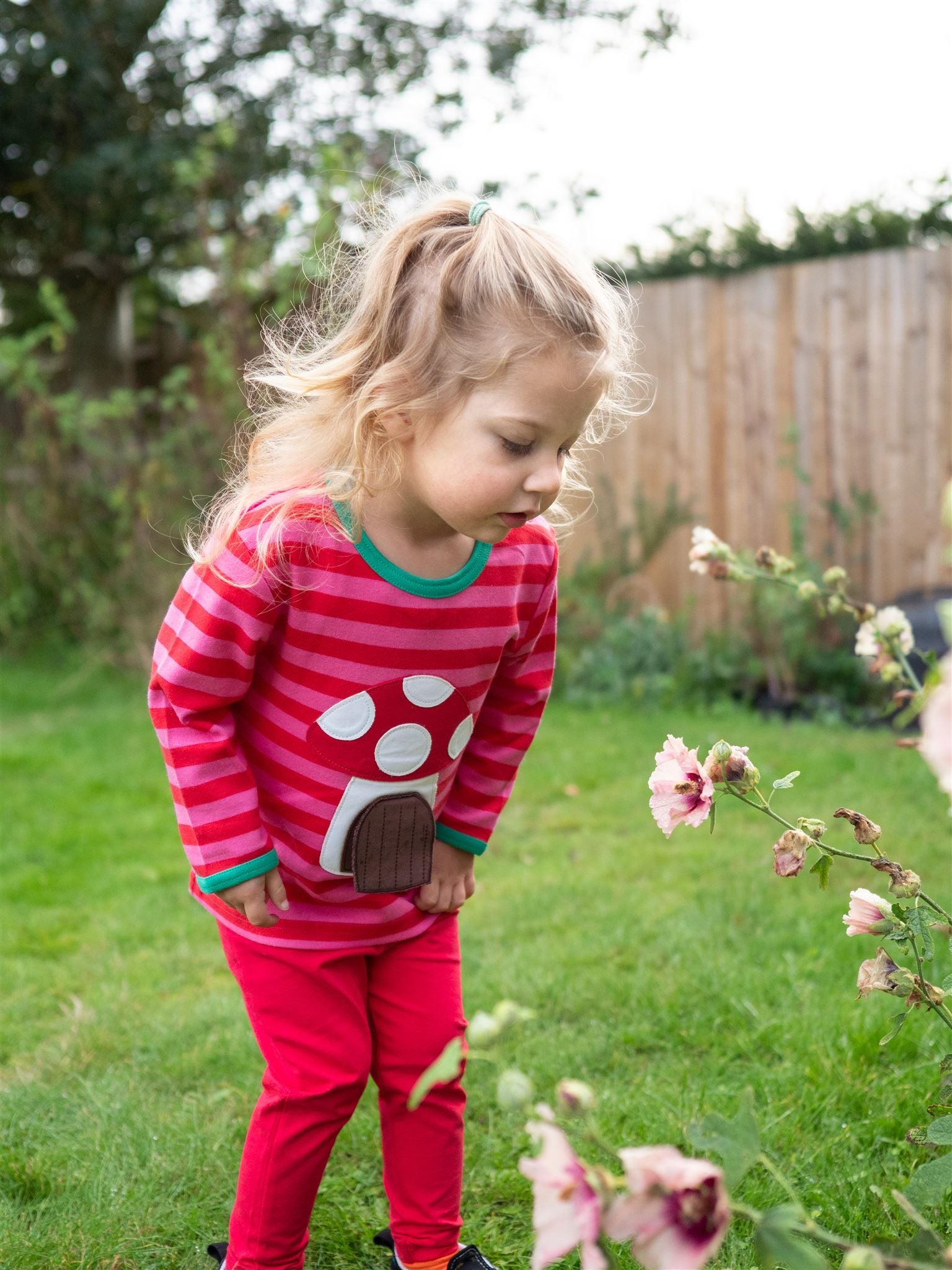 red and pink striped t shirt with mushroom and mouse applique
