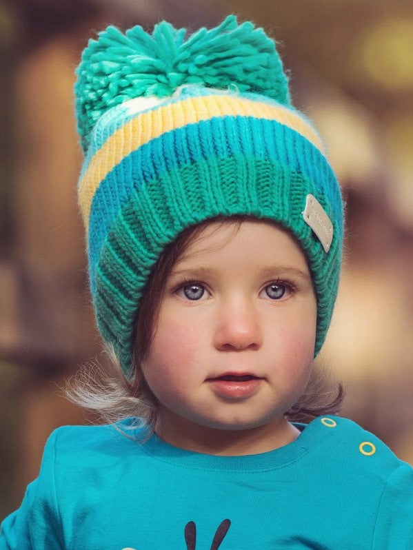blue green and mustard knitted bobble hat with pom pom